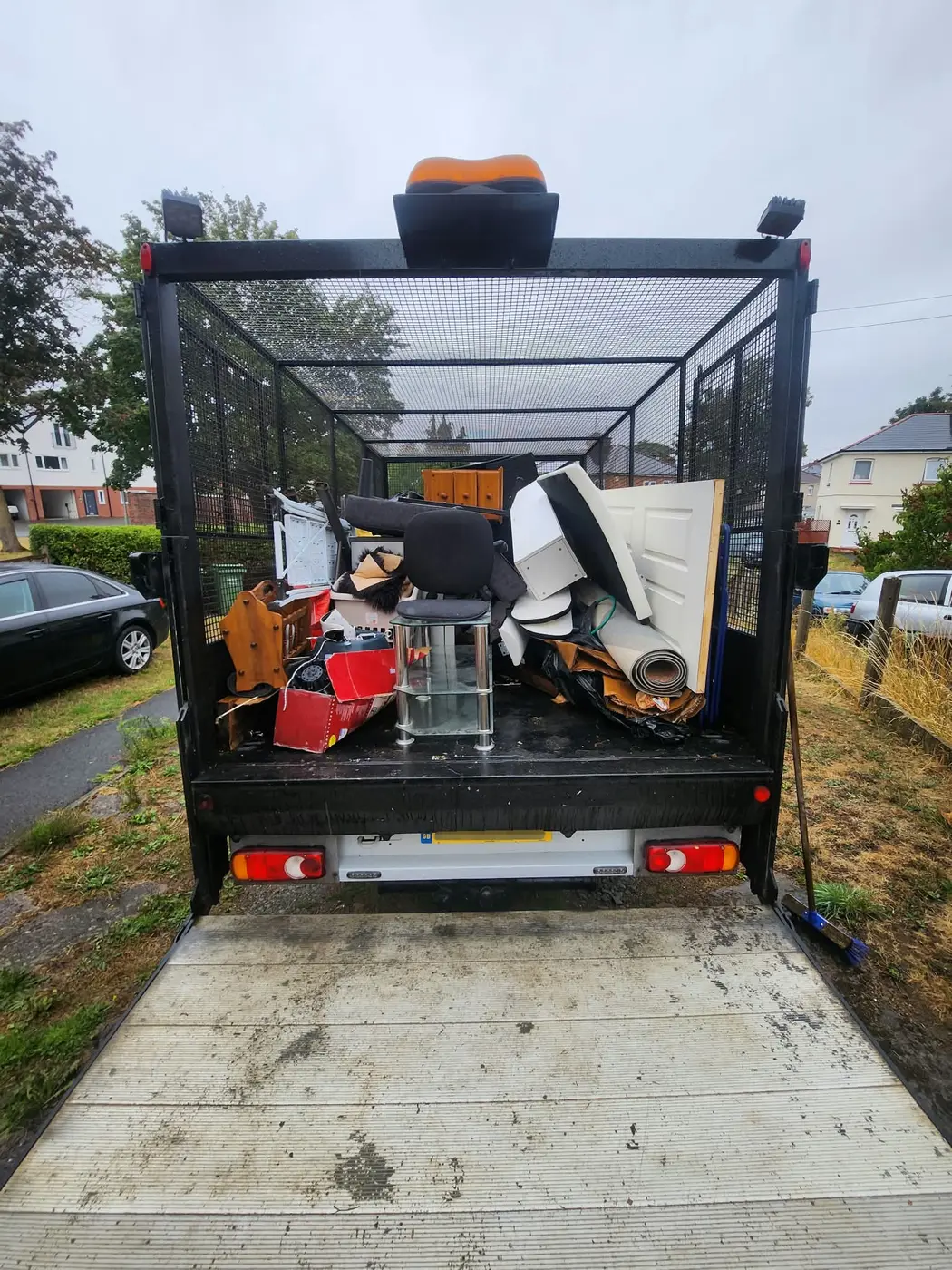 MR VAN Removals and Clearance cage truck loaded during a responsible waste clearance
